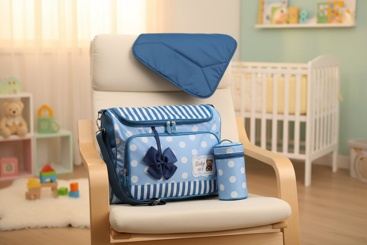 Blue polka dot diaper bag set with matching blanket on a white background