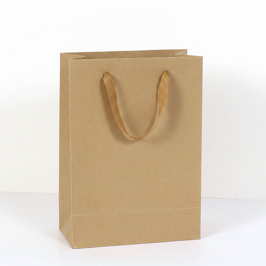 Brown paper bag with handles next to a bottle, showing dimensions.
