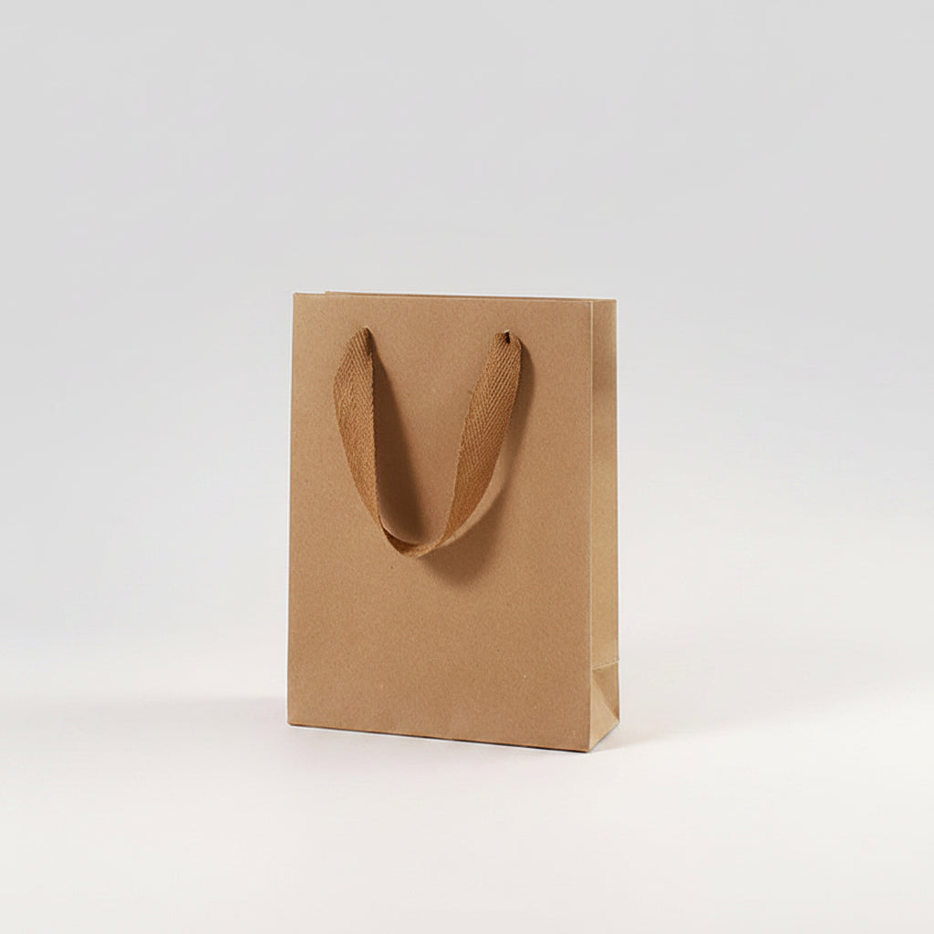 Brown paper bag with dimensions labeled next to a clear bottle on a white background