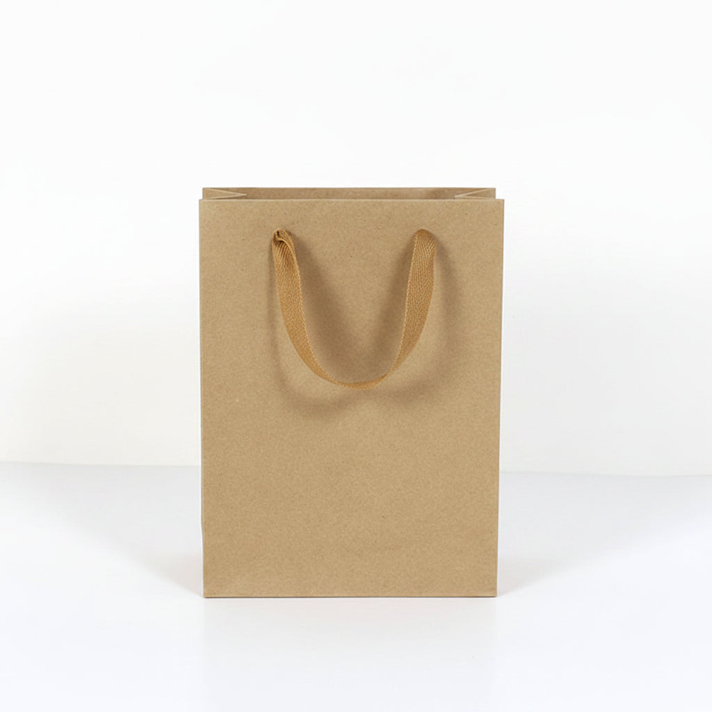 Brown paper bag with handles next to a water bottle, showing dimensions.