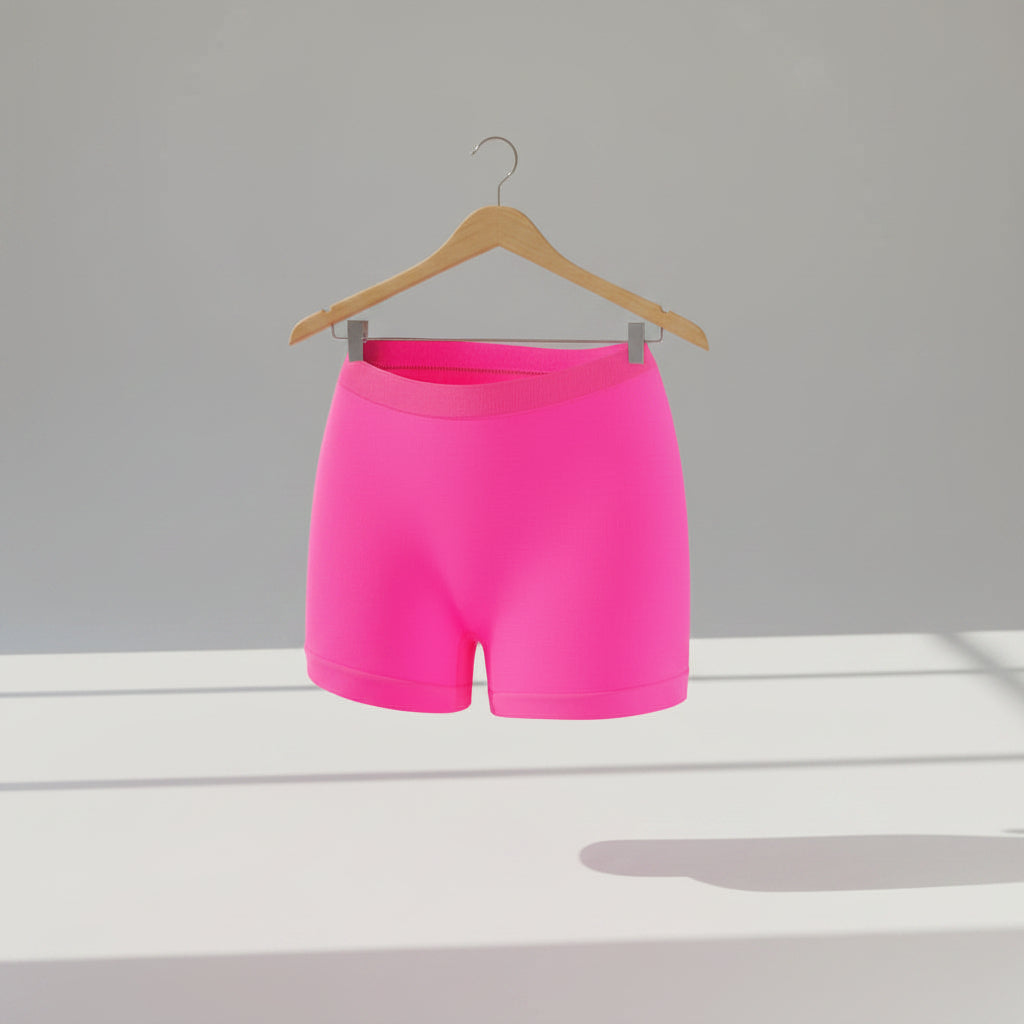 Bright pink shorts on a white background